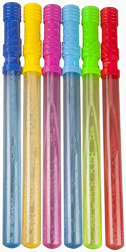 six different colored plastic toothbrushes lined up in a row on a white background