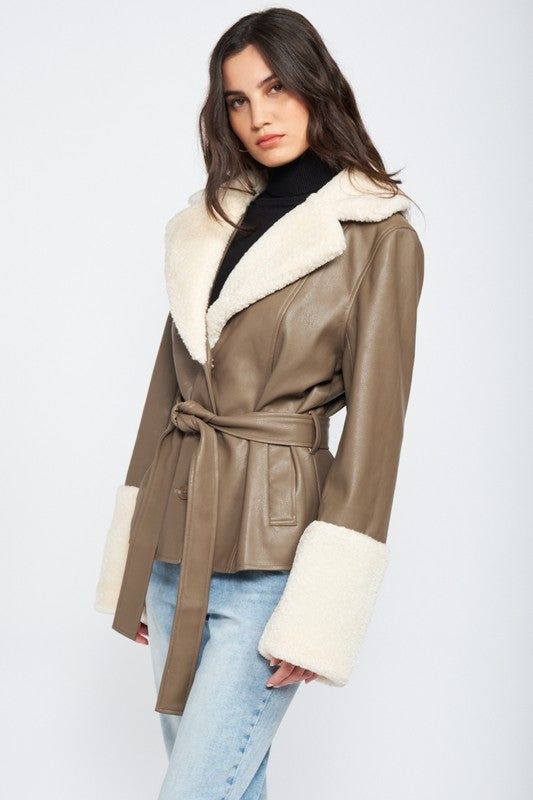 Introducing the Penny Girl Sherpa Jacket, a 70s-inspired masterpiece made from premium vegan leather. Featuring a luxurious Sherpa trim and a stylish belt tie closure, this jacket offers a timeless and sophisticated look that will keep you warm and fashionable. Upgrade your wardrobe with this stylish and cruelty-free statement piece. SIZE & FIT :MODEL WEARS SIZE SMALLMODEL'S HEIGHT 5'9 Made In: IMPORTED Fabric Contents: 55% POLYESTER, 45% POLYURETHANE Leather Jacket With Belt, Outwear Fashion, Fur Leather Jacket, Trim Jacket, Vegan Leather Jacket, Belted Jacket, Leather Denim, Faux Leather Jacket, Shearling Jacket