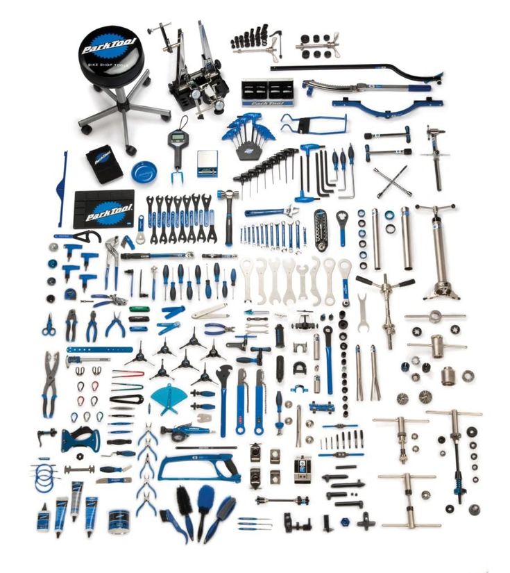 an assortment of tools are displayed on a white surface, including wrenches, pliers and other items