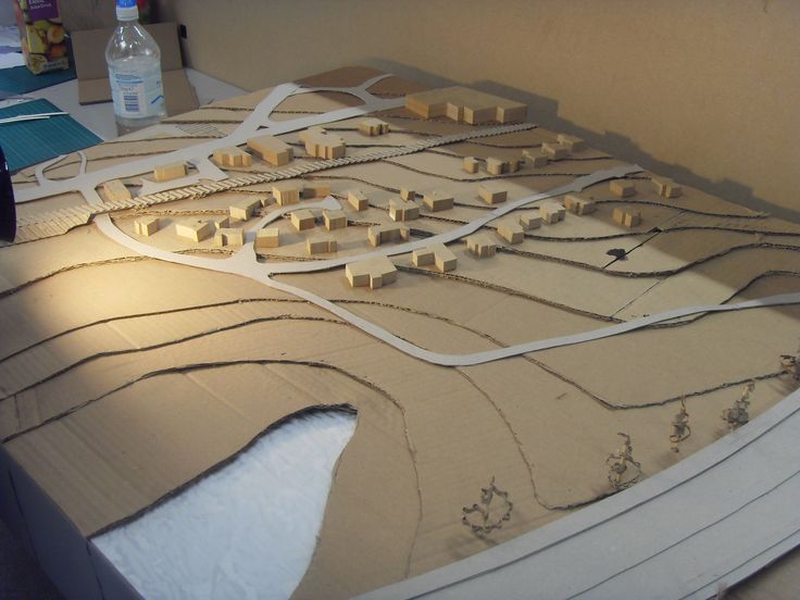 a model of a city with lots of buildings and roads on it's surface