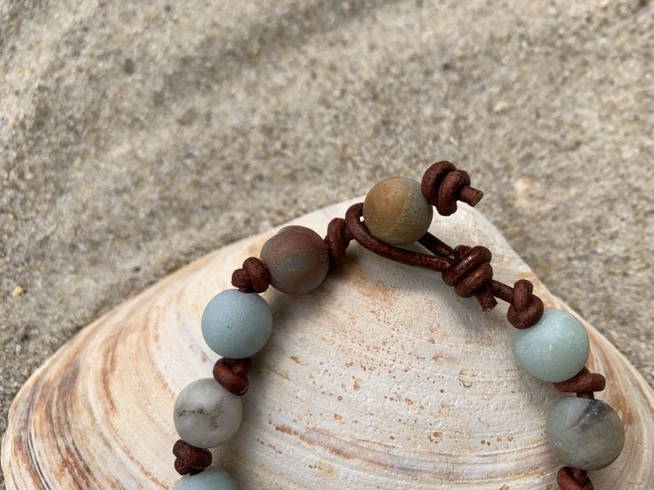 Matte Amazonite beads are hand knotted onto leather cord for a beachy, boho bracelet. A versatile bracelet that looks great at work or play! No more worrying about switching out jewelry for a night out after work. Choose the leather cord color of your new favorite bracelet. Leather jewelry also doesn't tangle as easily which is a big plus for travel. Order yours today!Please note the bracelets in the photos are representative of your bracelet. Amazonite naturally has varying shades in the stone Beachy Boho, Bracelet Leather, Boho Bracelet, Boho Bracelets, Leather Jewelry, Leather Cord, No More, Leather Bracelet, Black And Brown