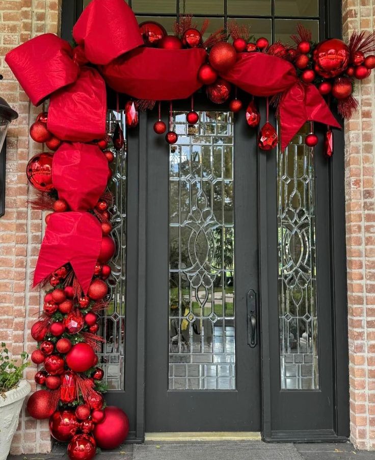 a door decorated with red ornaments and bows