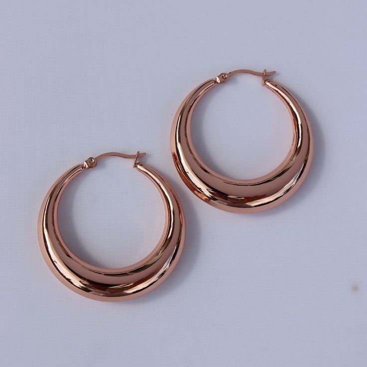 For a simple pair of earrings that always look fabulous, choose these light weight hoop earrings. With a hollow middle, made from stainless steel and finished with 14kt rose gold plating, these earrings are incredibly versatile. We love the shiny, sweet rose gold, and the lightweight feel for all day comfort. Shop these versatile earrings for yourself or for someone special to make a fabulous gift! Clean with a jewellery polishing cloth. Store in a safe place separately to avoid scratching. Rose Gold Jewelry Earrings, Rose Gold Hoop Earrings, Simple Rose, Jade Bangle, Rose Gold Jewelry, Gold Hoops, Rose Gold Earrings, Jewelry Earrings Hoops, Gold Hoop Earrings