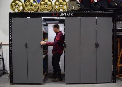 a man standing in front of two metal lockers