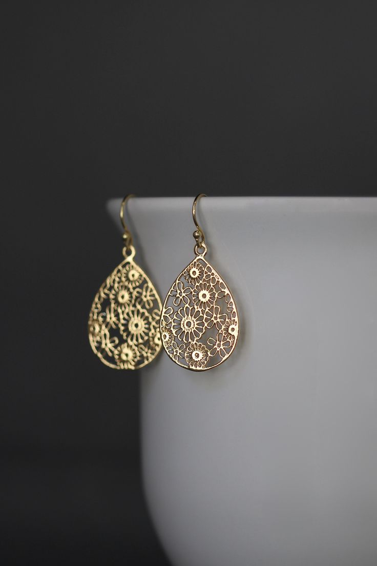 "Beautifully detailed 14k bright gold vermeil filigree teardrop flower charms simply dangle from 18k gold vermeil balled earwires. These lightweight go-with-everything earrings complete any outfit for daytime or evening. Gold flower charms: 19x29mm Total length of earrings: 1 1/2\" All gold is vermeil. A matching necklace is available... www.etsy.com/listing/942764148/gold-flower-pendant-necklace As the owner, maker, designer, and curator of this shop, I take great pride in providing you with je Earrings Gold Dangle, Turkish Gold Jewelry, Gold Filigree Earrings, Flower Earrings Gold, Gold Earrings Models, Gold Jewellry, Gold Jewelry Earrings, Gold Statement Earrings, Bridal Gold Jewellery Designs