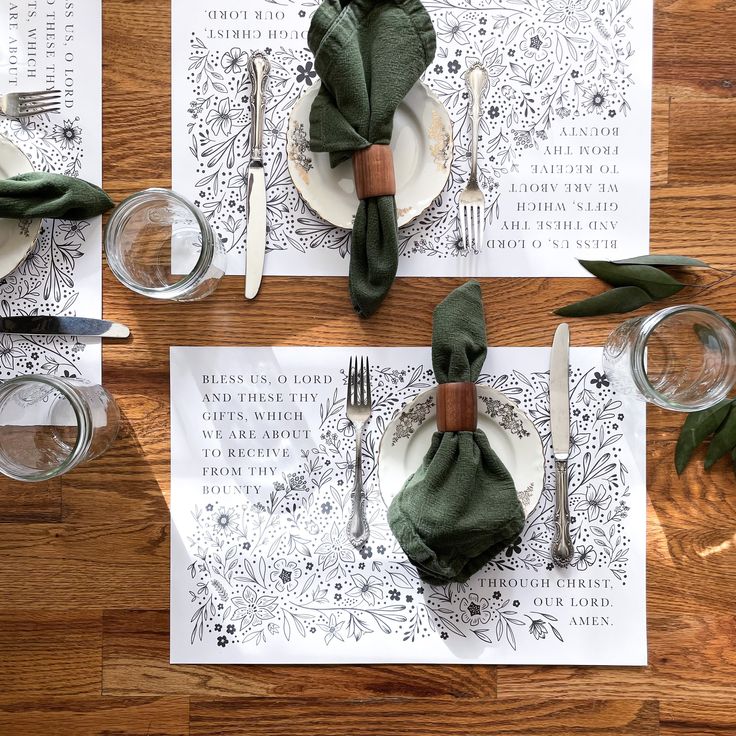 the place setting is laid out with napkins, silverware and green napkins