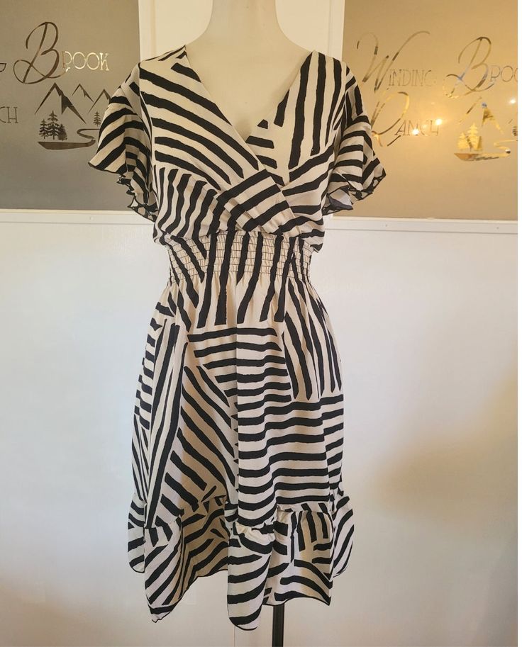 This Striped Flutter Sleeve dress goes from office to brunch and everywhere in between. It's the perfect summer dress. Light weight and breezy. Also see companion geometric design dress. One size fits most (0-12) 65% cotton 35% polyester Casual A-line Dress With Geometric Pattern, Summer A-line Patterned Dresses, Patterned A-line Summer Dress, Casual Summer Dresses With Geometric Pattern, A-line Midi Dress With Ruffle Hem For Vacation, Summer Patterned Midi Dress For Brunch, Chic Patterned Summer Mini Dress, Chic Patterned Mini Dress For Summer, Patterned Midi Dress For Summer Brunch