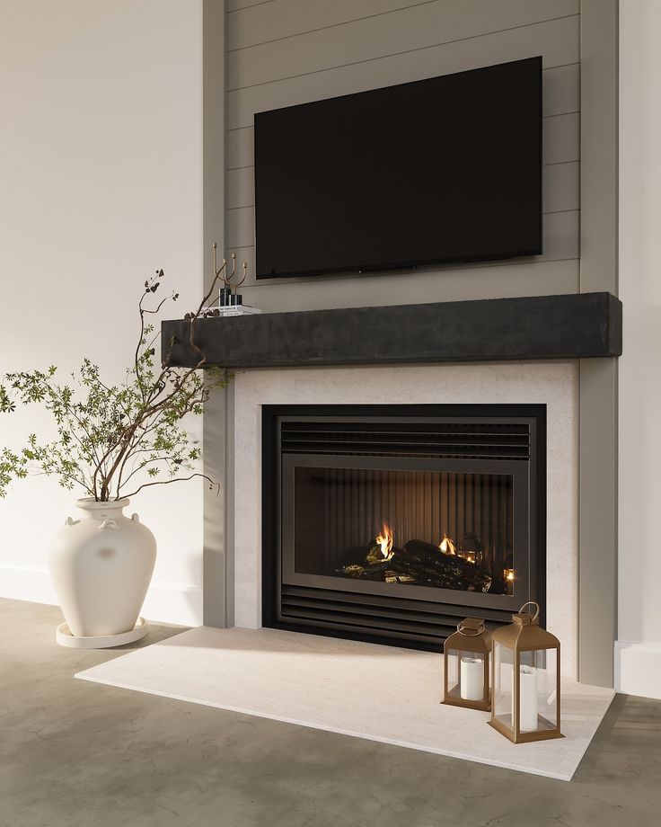 a living room with a fireplace and television mounted above the fire place in front of it