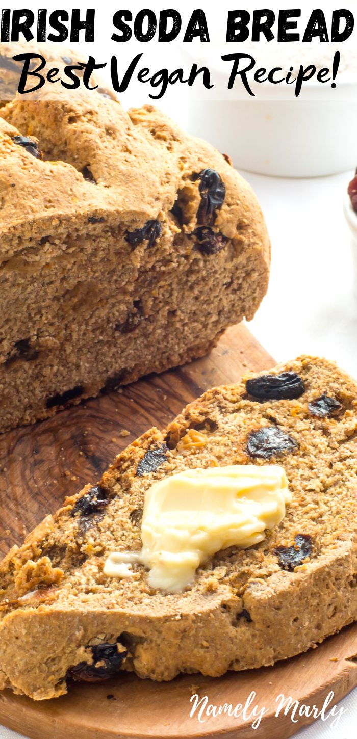 irish soda bread on a cutting board with butter and raisins