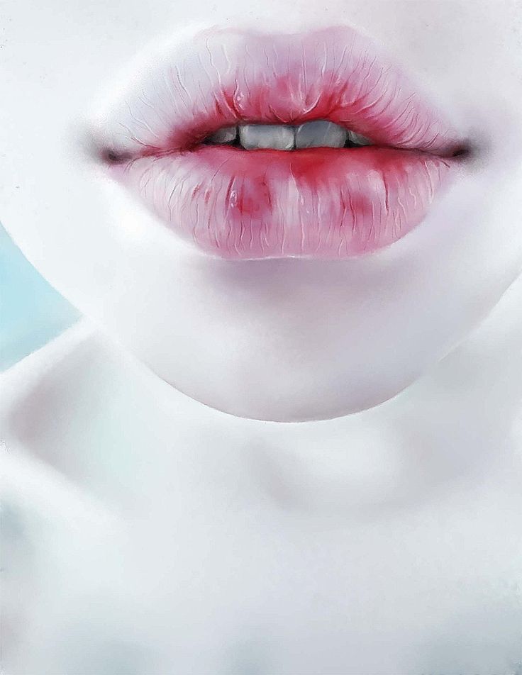 a woman's lips are painted with pink and red lipstick, while the lip is white