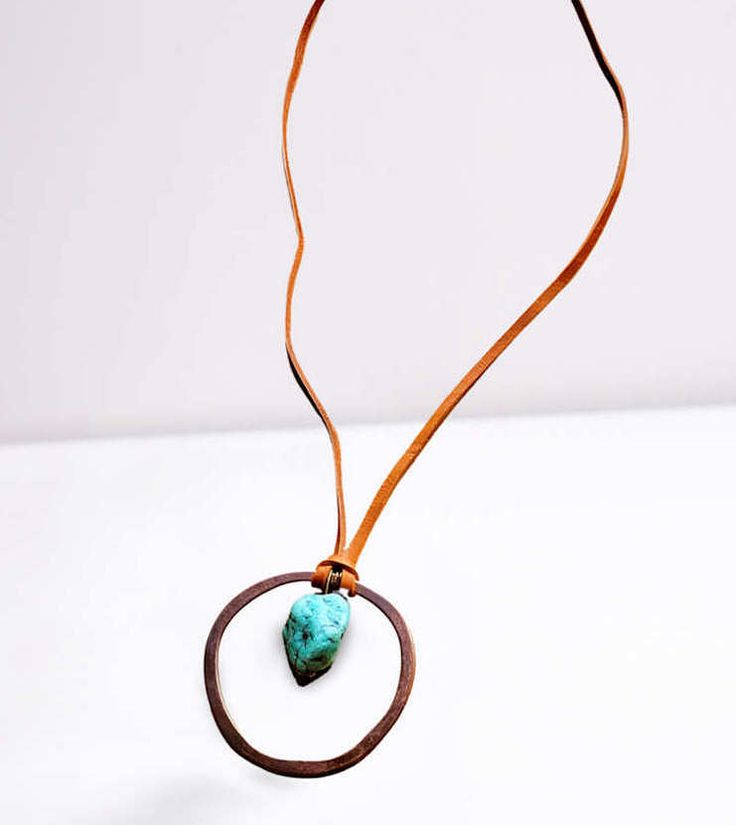 This genuine leather necklace is enhanced with a turquoise pendant in an Antique Gold Hoop, making it the perfect accessory for layering or for making a statement. Although your item will resemble the photo, each piece is created by hand, so no two are identical Entire length of necklace is 28 inches, Pendant will vary in size from 1"-2" (measurements are approx.) Weight: 2 oz (approx.) Made in United States Mountain Jewelry, Leather Cord Necklace, Leather Corded Necklace, Turquoise Leather, Seed Bead Jewelry, Cord Necklace, Turquoise Pendant, Leather Necklace, Gold Hoop