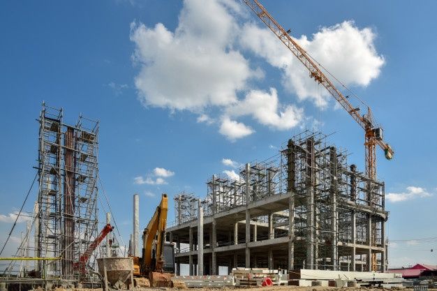 construction site with crane and building under construction