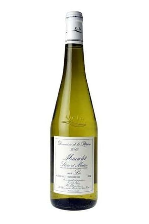 a bottle of white wine on a white background