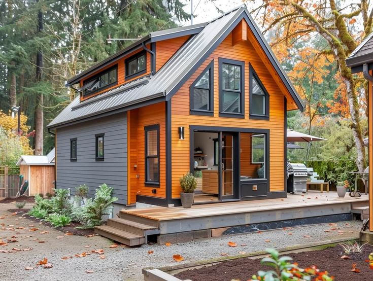 a small house in the woods surrounded by trees