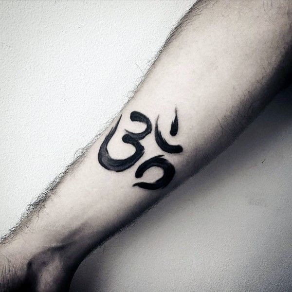 a man's arm with an omen symbol tattoo on the left side of his arm