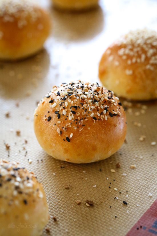 sesame seed bagels on a baking sheet ready to be baked