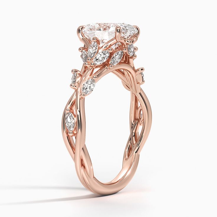 a rose gold engagement ring with an oval diamond center and twisted vine design on the band