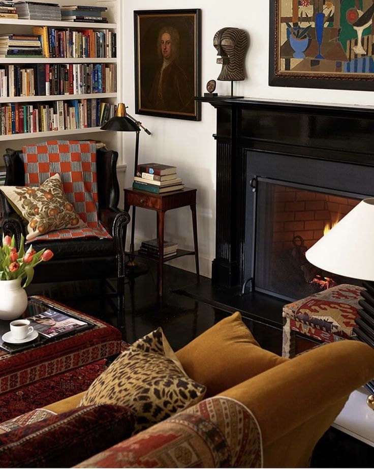 a living room filled with furniture and a fire place