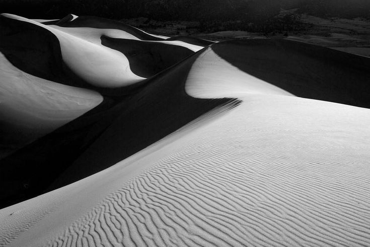 black and white photograph of sand dunes in the desert