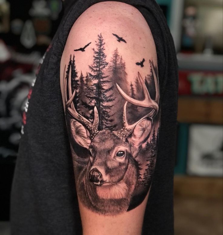 a man with a deer tattoo on his arm