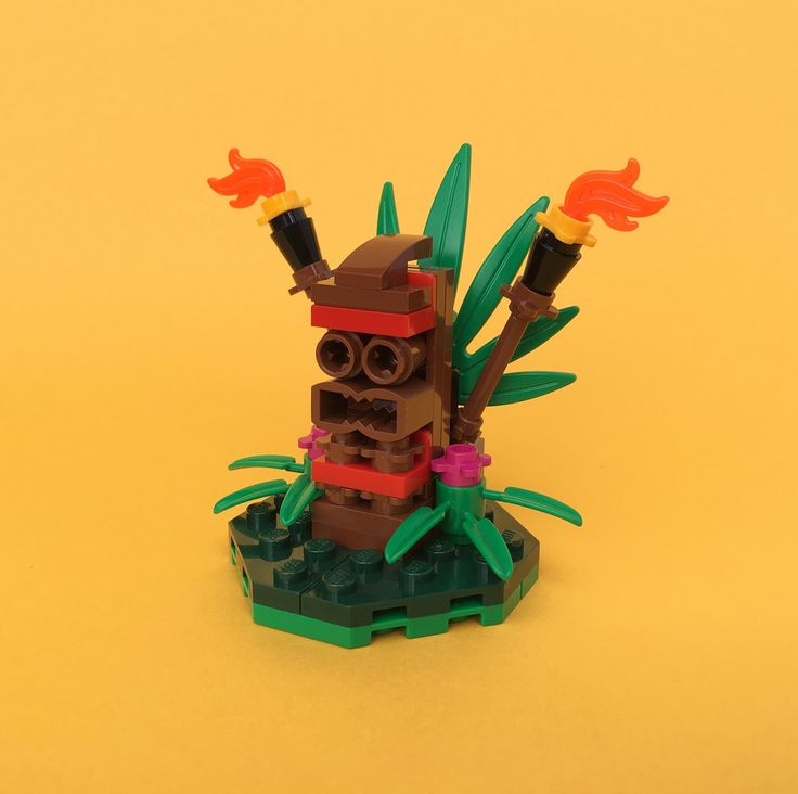 there is a lego tiki on top of a tree