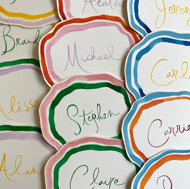 colorful name tags with names on them are shown in this image, and the words below each have different colors