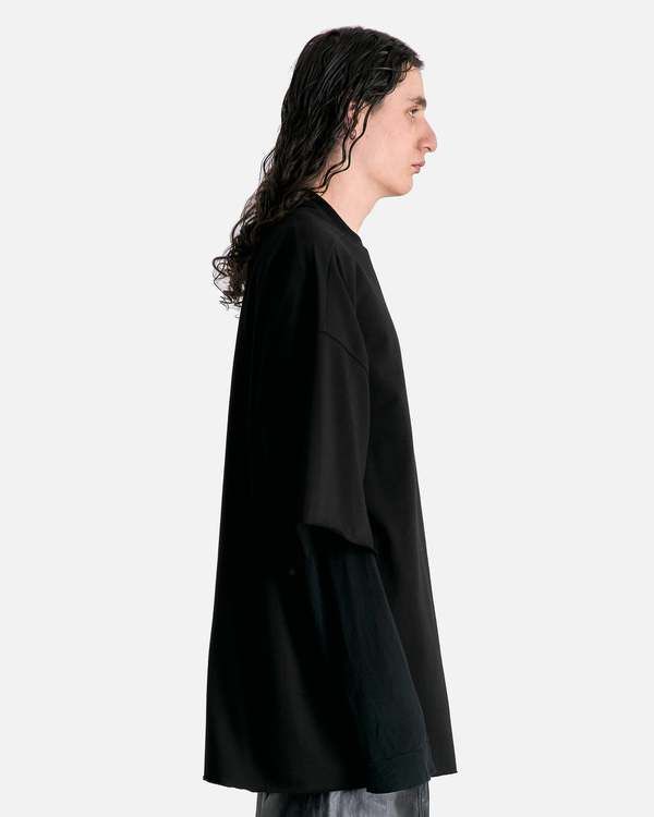 Rick owens tommy t in black. this shirt features a ribbed crewneck signature level shoulder seams dropped shoulder seams 3/4 sleeves raw cut cuffs and hem and a seam running down the center back. Black Oversized Top With 3/4 Sleeves, Oversized Black Top With 3/4 Sleeves, Rick Owens Men, Satin Bags, Rachel Comey, Engineered Garments, Waist Length, Black Blazers, Rick Owens