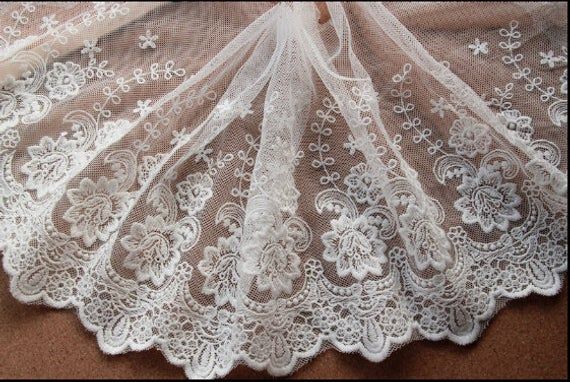 an image of white lace on fabric