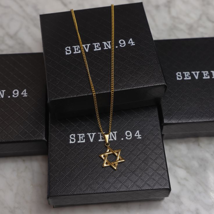 Our Gold Star of David is made from Premium quality 316L stainless steel. This allows the pendant and chain to be waterproof and sweat resistant. This chain can be worn on its own as a statement or be layered with other chains from our shop.DETAILS & MATERIALS ◈ Chain Length: 20.8 Inches◈ Chain Width: 2.2 MM◈ Chain Style: Curb chain◈ Pendant Size: 24mm x 18mm x 2.1mm◈ Chain Quality: 316L stainless steel with PVD vacuum 18K gold plating◈ Chain Clasp: Lobster◈ Model is male, 5'10 & size medium◈ Hy Star-shaped Metal Chain Necklace As Gift, Star Shaped Metal Chain Necklace As Gift, Star-shaped Metal Chain Necklace For Gift, Stainless Steel Necklace With Star Charm For Gift, Stainless Steel Necklace With Star Charm As Gift, Star Of David Tarnish Resistant Necklace Gift, Stainless Steel Necklaces With Star Charm For Gifts, Star-shaped Stainless Steel Necklace For Gift, Gold Star Of David Necklace Nickel Free