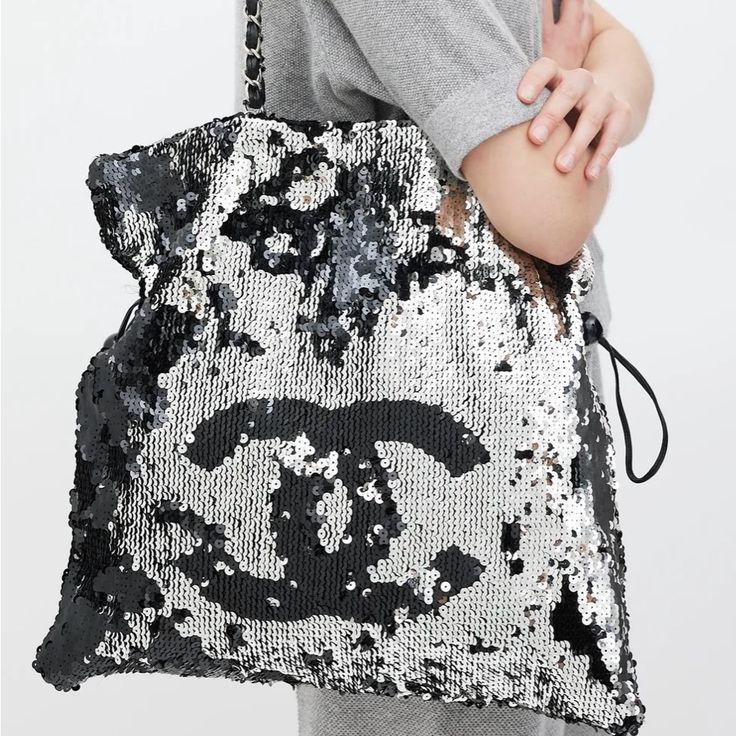 Chanel Sequin Bag -Black & Silver Sequin -Drawstrings At Side **Excellent Condition Vs Luxury Silver Shoulder Bag For Shopping, Silver Tote Bag For Evening, Silver Evening Tote Bag, Designer Silver Shoulder Bag For Party, Designer Silver Shoulder Bag With Dust Bag, Luxury Metallic Silver Bags For Party, Silver Tote Bag For Party, Chic Silver Bag With Sequins, Chic Metallic Silver Party Bags