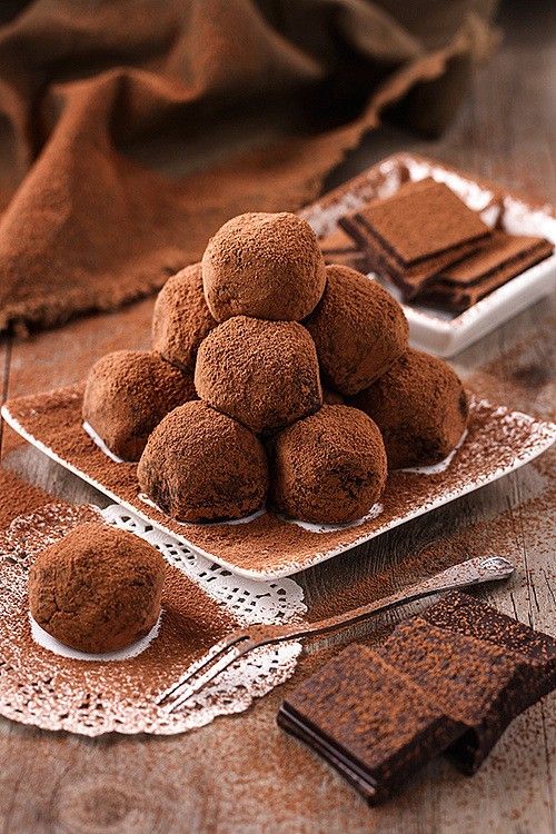 chocolate truffles are stacked on top of each other and ready to be eaten