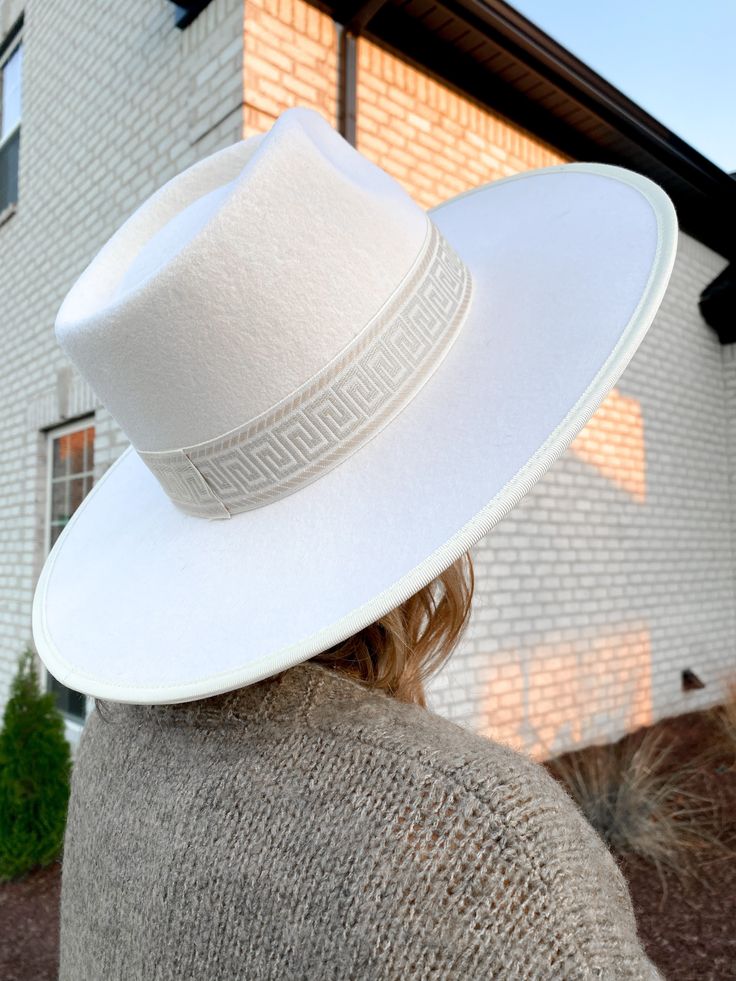 Perfect addition to any outfit! All white, 100% stiff wool, wide brim hat. Features a unique tribal print accent band and pinched crown. Adjustable inner Velcro band, to personalize your fit. 7" inside width, 4" brim Elegant Hats, Elegant Sophisticated, Wide Brimmed Hats, Brim Hat, Wool Hat, All White, Wide Brimmed, Panama Hat, Floppy Hat