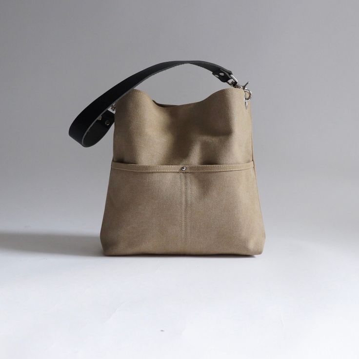 Urban-chic style crossbody bags that are neutral in color and effortlessly casual. When you need a mid-sized bag with easy access front pockets, just the right amount of not-too-slouchy shape and the perfect neutral shade, our updated take on the modern hobo bag is sized just right for everyday, on-the-go use. This listing is for the MEDIUM size bag in Khaki canvas. Hobo Bags For Women, Canvas Hobo Bag, Urban Chic Fashion, Hobo Crossbody Bag, Hobo Bags, Fabric Bags, Waxed Canvas, Urban Chic, Hobo Bag