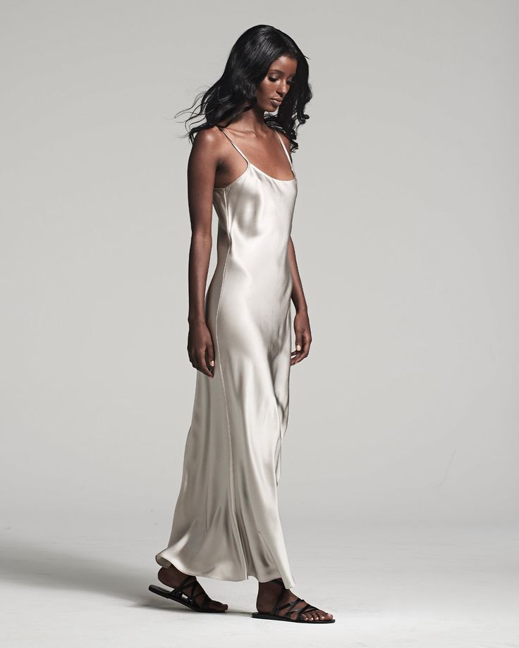 Named by Vogue as a must-have, this easy to wear luxury charmeuse slip dress is the perfect day to night staple. Featuring a bias cut and the finest silk quality, it shapes flatteringly to every type of body. Bias cut silk charmeuse slip elegantly drapes on the body. 100% Silk Charmeuse Made in New York City Model is wearing a size S and is 5'10" Product Care: Dry Clean Only Rayon Wrap Dress, Red Strapless Dress, City Model, Convertible Dress, Midi Slip Dress, The Perfect Day, Silk Slip Dress, Dress The Population, Silk Tank