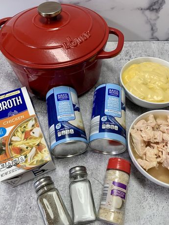 ingredients to make chicken soup laid out on a counter