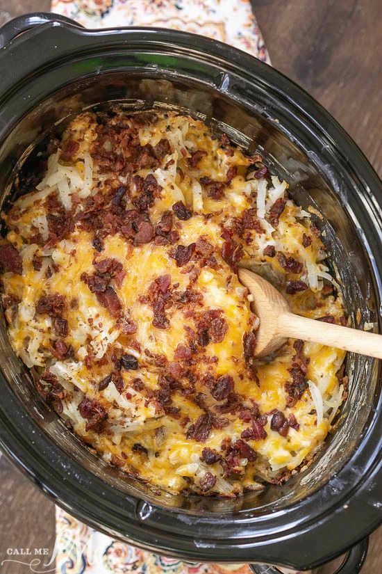 a crock pot filled with cheese and bacon