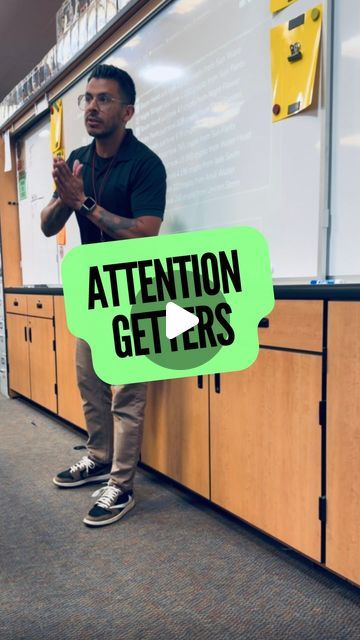 a man standing in front of a whiteboard with the words attention getters written on it