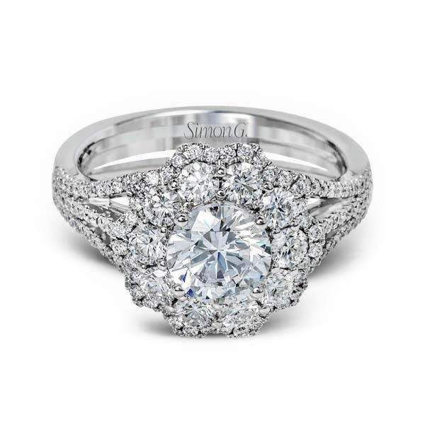 a diamond engagement ring with two rows of diamonds on the band and an oval center stone surrounded