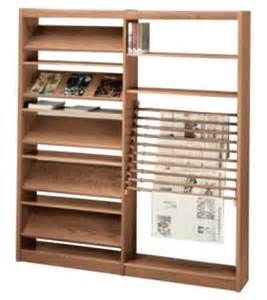 a wooden book shelf with many books on it