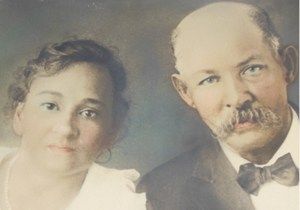 an old photo of a man and woman posing for a picture with the caption's name on it