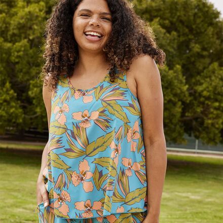 A good warm-weather top is a closet staple. This fun-loving tank embodies the trail-to-tasting room lifestyle with an active, water-friendly build and fun prints that dress up just when you need them to. Bonus: Make it a set with our Sunkissed Shorts for double the good vibes. Sleeveless Summer Tankini For Spring, Spring Summer Sleeveless Tankini, Spring Sleeveless Summer Tankini, Sleeveless Athleisure Tops For Day Out, Summer Athleisure Activewear For Day Out, Sleeveless Tankini With Tropical Print For Summer, Playful Summer Activewear, Spring Tropical Print Tops For Loungewear, Summer Sleeveless Tank Top For Warm Weather