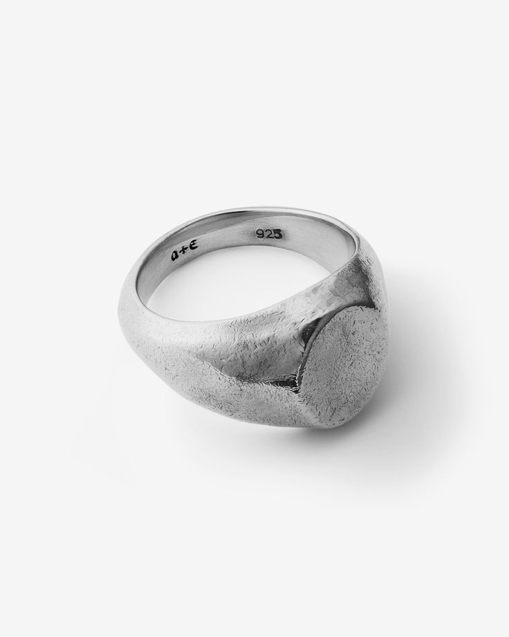 A convergence of minimalism and imperfection, this 925 sterling Silver signet ring features a vertical oval countenance with raw, handmade textures that render a flawlessly ageless subtle grit; an indispensable favourite. This demi-fine piece is a versatile addition to any jewelry collection, suitable for all genders and expressions. Perfect for easy, everyday styling on its own or as a complement to any ring stack. Sold individually. Each piece is lovingly crafted by hand, under ethical working Silver Oval Signet Ring For Everyday, Silver Oval Dome Ring Minimalist Style, Minimalist Oval Sterling Silver Signet Ring, Silver Minimalist Oval Dome Ring, Minimalist Silver Oval Dome Ring, Oval Sterling Silver Dome Ring For Everyday Wear, Minimalist Oval Sterling Silver Engraved Ring, Minimalist Oval Engraved Ring Stamped 925, Minimalist Oxidized Finish Signet Ring As A Gift