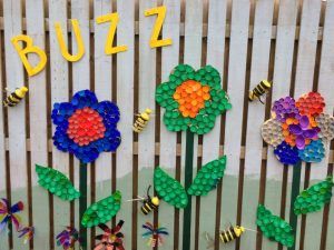 the flowers are made out of legos and have words on them that say buzz