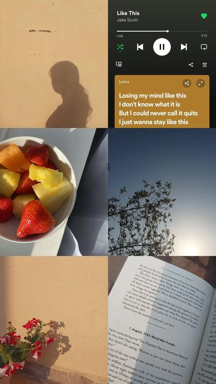 an open book sitting next to a bowl of fruit