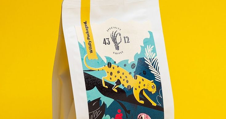 a paper bag with an image of a leopard and other animals printed on the side