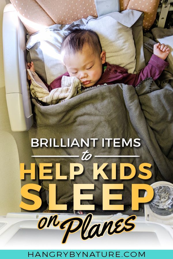 a baby sleeping in a bed with the words brilliant items to help kids sleep on planes