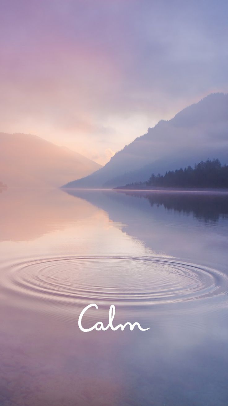 a calm lake with the word calm in front of it and an image of mountains