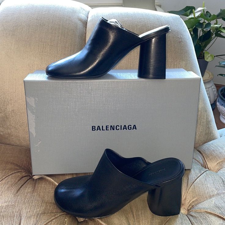 New Authentic Balenciaga Sandals, Open Slip On, Black Glove Mules, 100% Soft Sheep Skin, Features A Round Toe, & A Distinctive Curve Heel, 80mm, Curved Heel, Balenciaga Logo On The Footbed, Leather Sole, European Size 38, Fits Us Size 8, Includes Box & Dust Bag, Made In Italy Black Luxury Mules With Sculpted Heel, Luxury Black Mules With Sculpted Heel, Luxury Black Mules With Wrapped Heel, Designer Mules With Contrasting Heel For Work, Designer Mules With Sculpted Heel For Office, Designer Black Mules With Sculpted Heel, Designer Black Block Heel Mules, Designer Black Mules With Block Heel, Designer Mules With Wrapped Heel