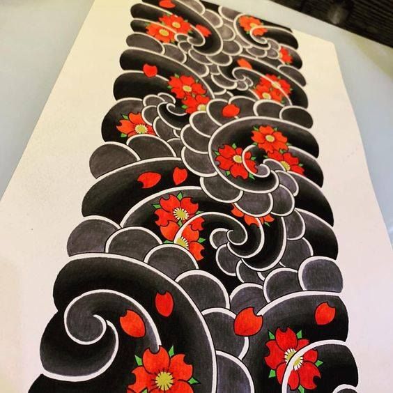 an artistically designed piece of paper with red flowers on black and white lines in the center