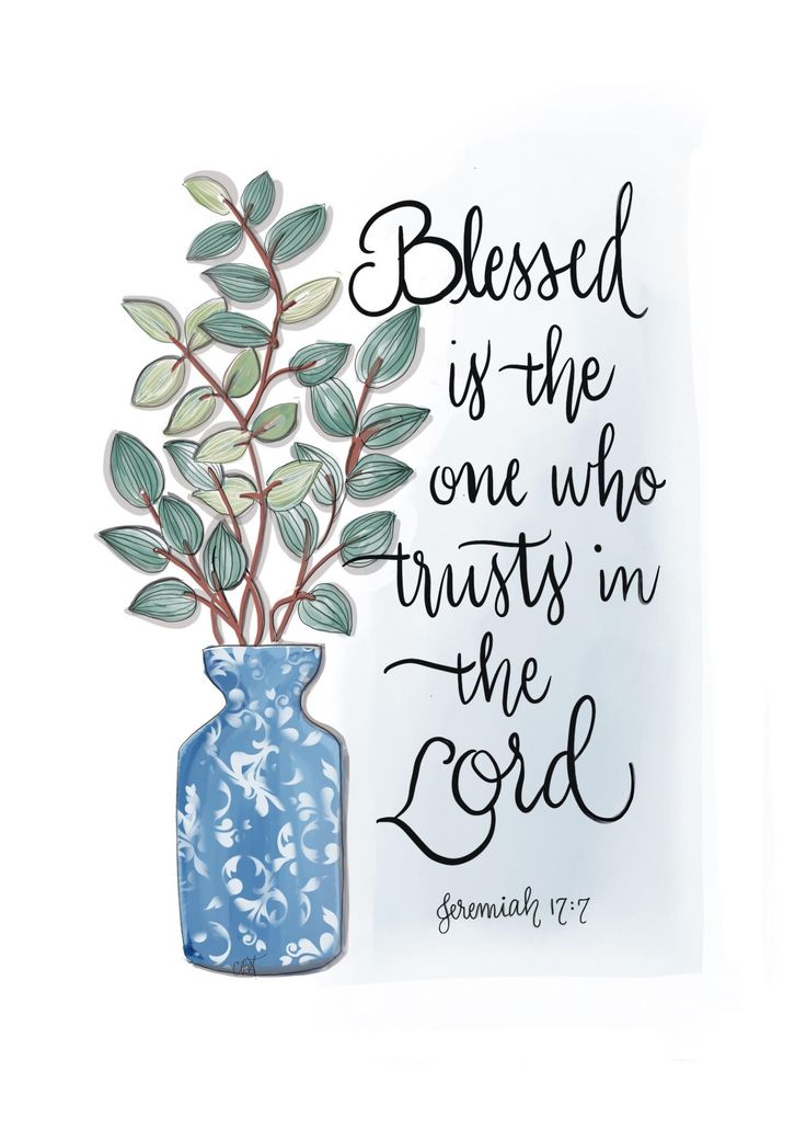 a blue vase filled with green leaves sitting next to a white sign that says, blessing is the one who trusts in the lord